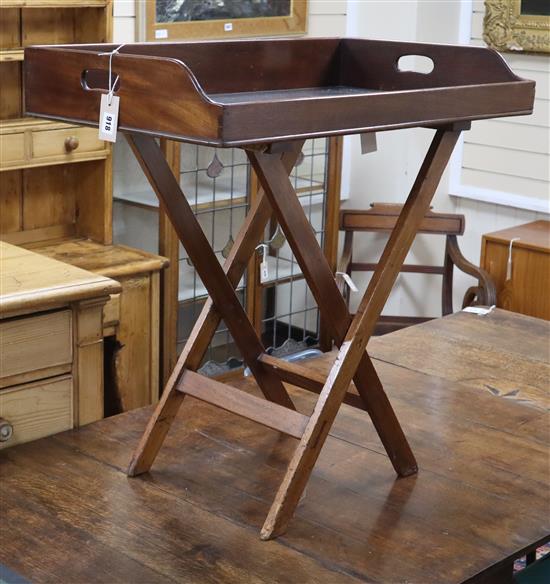 A mahogany butlers tray on associated stand Tray 80cm wide